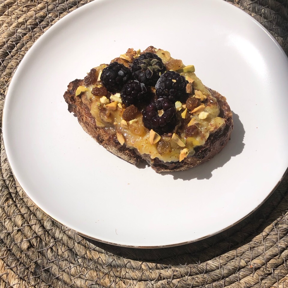Almond butter, caramelised banana and blackberries rye toast