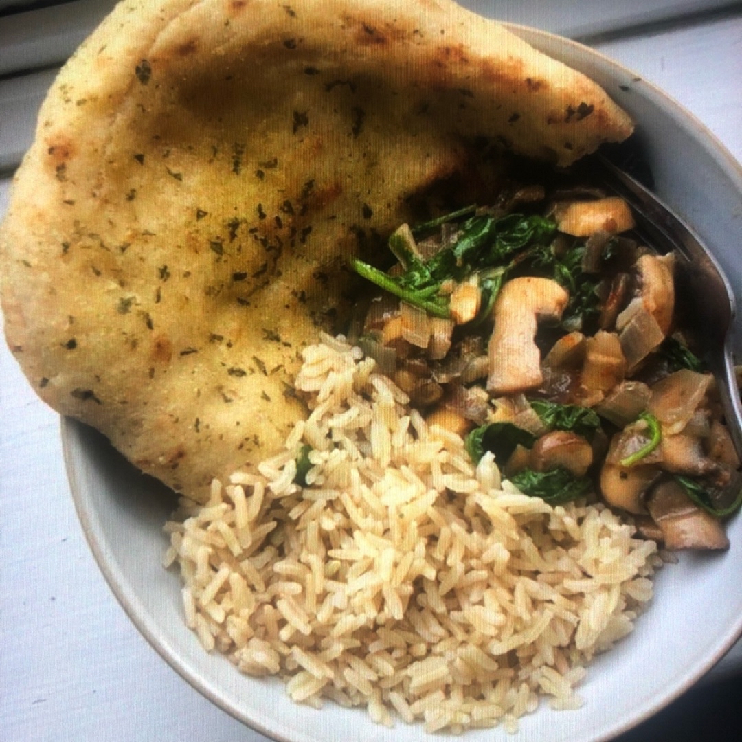 Mushroom rice with spinach and garlic flatbread Mushroom rice with spinach and garlic flatbread