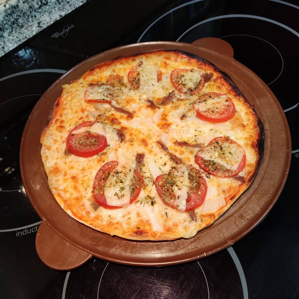 Fajipizza de anchoas y parmesano Fajipizza de anchoas y parmesano