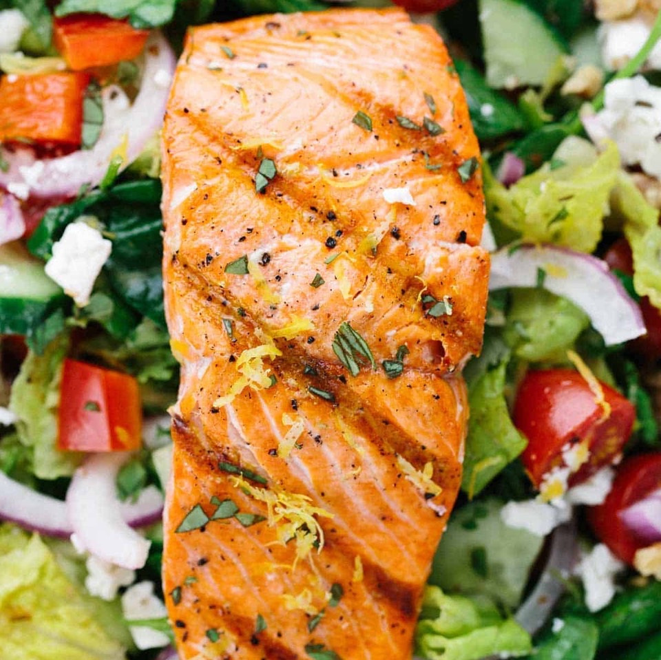 Grilled salmon with side lettuce salad Grilled salmon with side lettuce salad
